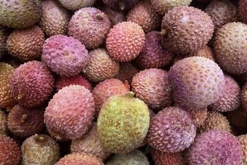 Stack of Lychees on a market stall