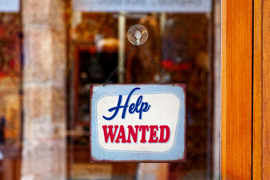 Help wanted sign in a store window
