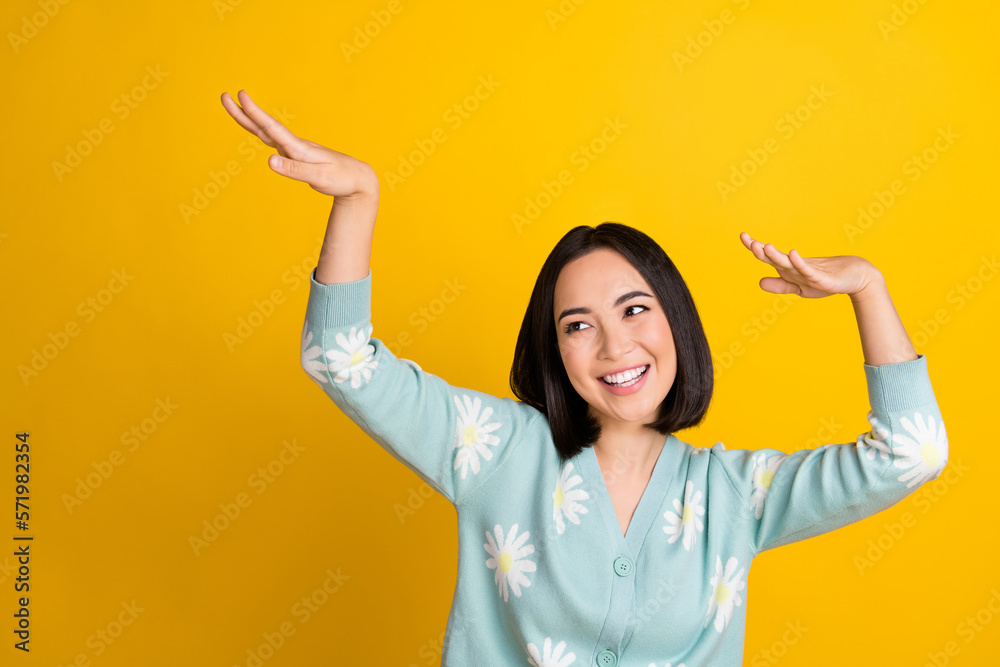 Sticker Photo of chilling have fun relaxed japanese girl bob hair boogie woogie dance hands up look empty space carefree isolated on yellow color background