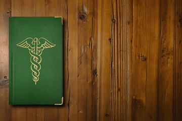 Medical book on a wooden desk