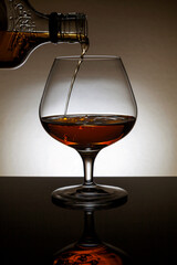 Backlit glass of cognac