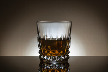 Backlit glass of whiskey