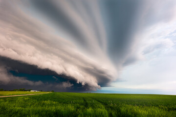 Naklejka na ściany i meble Storm clouds over a field