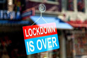 Lockdown is over sign in a store window