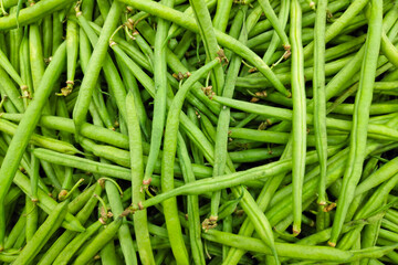 Stack of green beans in a market stall