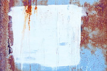 White square painted on a rusty iron plate