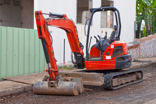 Red mini excavator