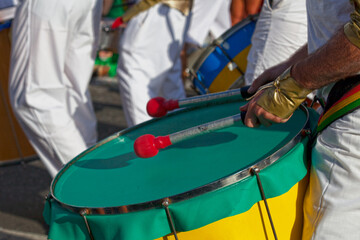 Percussionist playing with a drum during the carnival of Grand Boucan