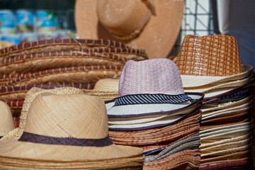 Straw hats for sale on a market stall