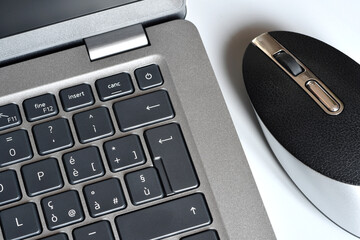 laptop and mouse on table