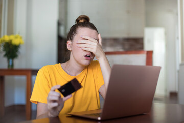 Internet fraud. Nervous sad upset unhappy confused young woman, stressed worried lady having...