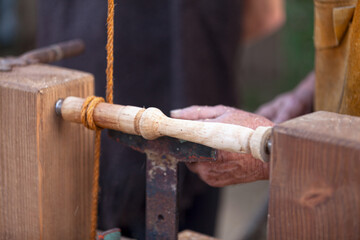 Medieval wood worker doing woodturning