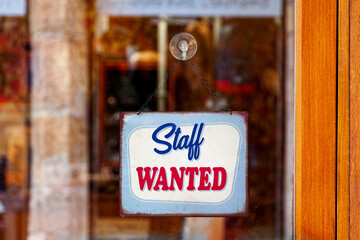Staff wanted sign in a store window