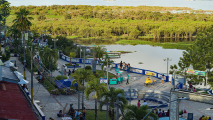 Seawalk in Iquitos Peru with people next to amazon river