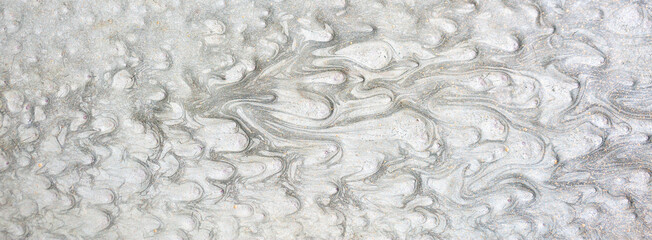 Texture of paint stains on the wall, cracked paint on an old metal surface. Sheet of silver metal with cracked and peeling paint, background for design with copy space.