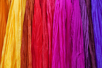Row of colorful silk scarves