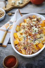 Baked pumpkin with blue cheese and walnuts, gratin