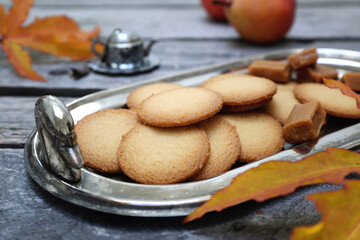 Palets bretons, french cookies. Salted caramel Shortbread Breton cookies and autumn leaves