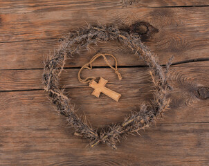 wreath of thorns on wooden background