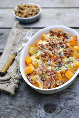 Baked pumpkin with blue cheese and walnuts, gratin