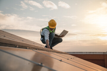 Service engineer checking solar cell on the roof for maintenance if there is a damaged part. Engineer worker install solar panel. Clean energy concept.