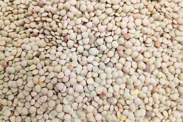 Stack of white lentils on a market stall
