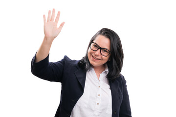 Entrepreneur woman  with friendly expression waving hand