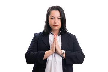 Businesswoman holding hands together as praying thankful gesture