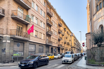 Naklejka na ściany i meble Cars parked on both sides of a road in Turin, Italy