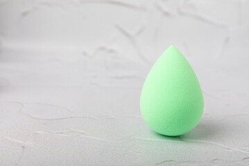 Beauty blender on marble background.Bright sponges for make-up cosmetics. Makeup products. Beauty concept. Place for text. Space for copy. Flat lay