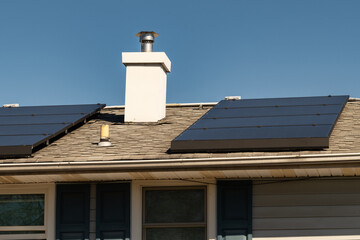 modern houses with solar panels on the roof for alternative energy