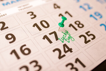 Calendar closeup with text Lucky day on 17 March - Happy Saint Patrick's day