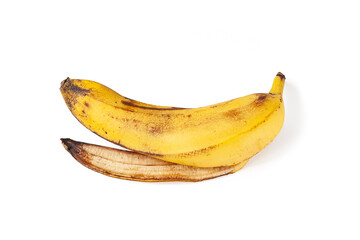 Banana peel on a white background. Overripe banana close-up