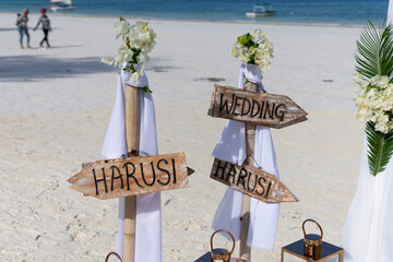 Sun-kissed beach wedding reception in Zanzibar adorned with beautiful decor