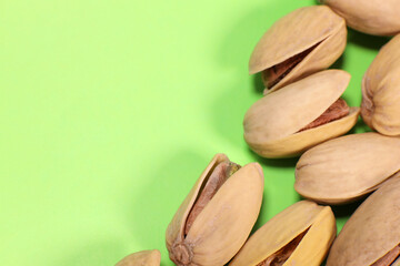 pistachios on a green background close-up macro