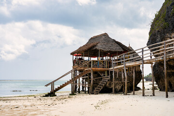 Sunny vacation at Mtende Beach, Zanzibar, surrounded by rocks for a peaceful retreat