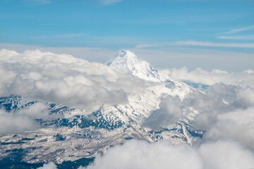 Snow Covered Mount Hood in Oegon From Above With Clouds in Sky