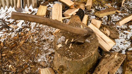 Firewood for the oven. Wood preparation. Chopping wood. Household. Cutting with an axe.