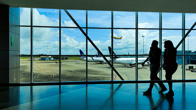silhouettes of people in the airport