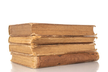 Four old books, macro, isolated on white background.