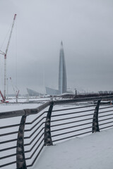Bridge over the river and embankment in winter in a big city.