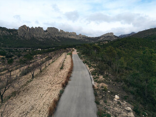 Fototapeta na wymiar Road across Castellets Ridge near Puig Campana, from near Altea Benidorm, Spain.Scenic mountain road inland Costa Blanca.