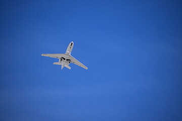 Fototapeta na wymiar Airplane in the Blue Sky