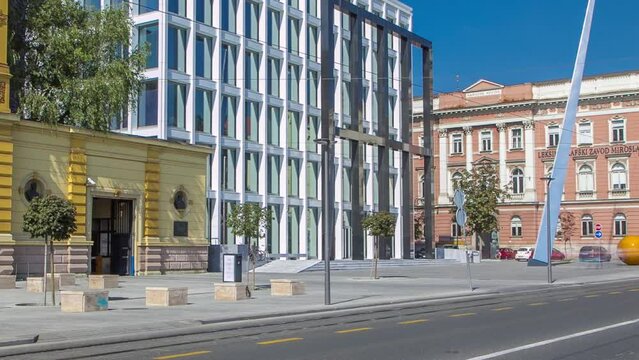 New building of Croatian Music Academy timelapse in Zagreb, Croatia. Traffic with cars on the street, blue cloudy sky at sunny day