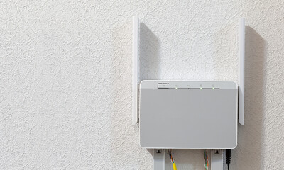 Dual-band home router on the wall, copyspace