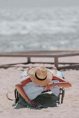 person relaxing on the beach woman sun hat reading miami 