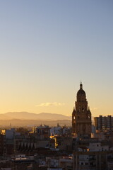 Fototapeta premium Sunset in Murcia with the cathedral tower in the background