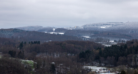 View over the Stettbachtal near Seeheim-Jugenheim in the direction of the Modautal and Lichtenberg Castle in winter with snow
