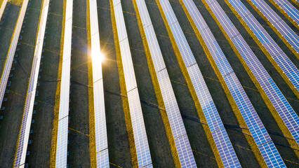 Photovoltaics panels with sunbeam. Solar power from above. Sun powerplants is a important part of circular economy.