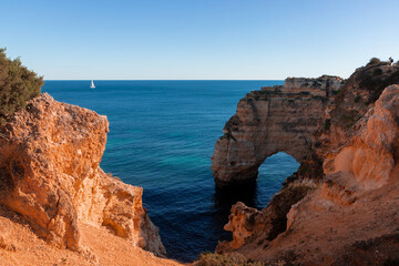 Fototapeta na wymiar Landscape of the rocky coast of the Algarve - Portugal in the evening